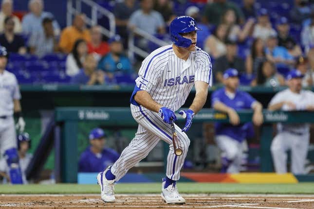 Mar 12, 2023; Miami, Florida, USA; Israel first baseman Matt Mervis (27) hits a single during the first inning against Nicaragua at LoanDepot Park.