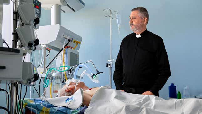 Image for article titled Priest Never Sure How To Fill Awkward Silence After Last Rites Finished But Before Person Dies