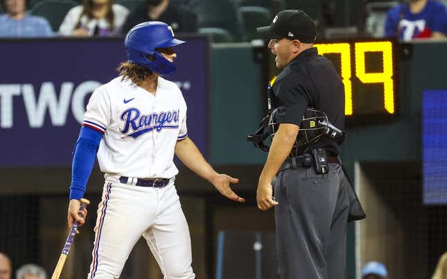 Apr 12, 2023; Arlington, Texas, USA;  Texas Rangers shortstop Josh Smith (47) argues with umpire Jansen Visconti (52) after striking out during the ninth inning at Globe Life Field.