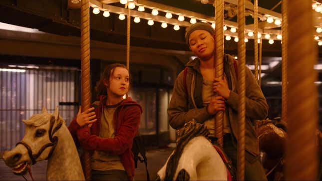 Bella Ramsey as Ellie and Storm Reid as Riley ride a carousel in a scene from HBO's The Last of Us.