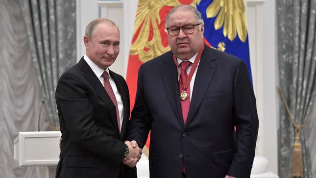Putin shakes hands with Usmanov during an awarding ceremony at the Kremlin in Moscow, Russia November 2018.