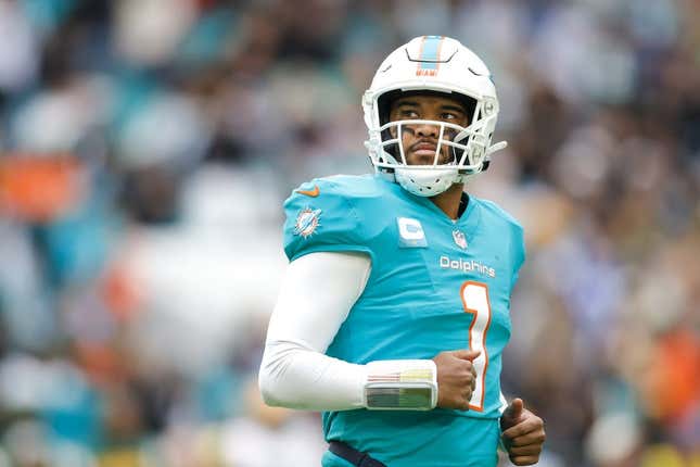 Dec 25, 2022; Miami Gardens, Florida, USA; Miami Dolphins quarterback Tua Tagovailoa (1) looks on from the field during the second quarter against the Green Bay Packers at Hard Rock Stadium.