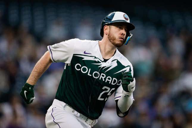 May 3, 2023; Denver, Colorado, USA; Colorado Rockies first baseman C.J. Cron (25) runs to second on a double in the fourth inning against the Milwaukee Brewers at Coors Field.