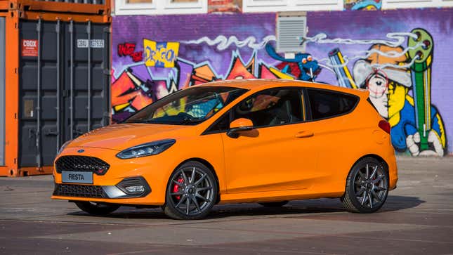 Mostly side view of a Ford Fiesta ST in orange