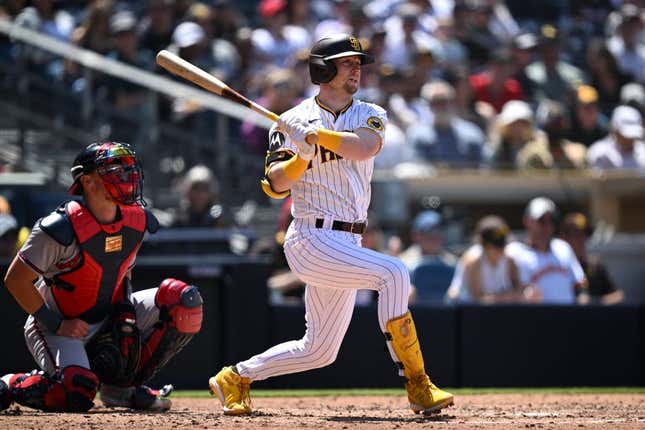 Apr 19, 2023; San Diego, California, USA; San Diego Padres first baseman Jake Cronenworth (9) hits a double against the Atlanta Braves during the fourth inning at Petco Park.