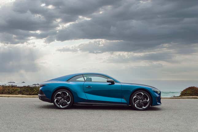 Side view of Bentley Batur under gray clouds