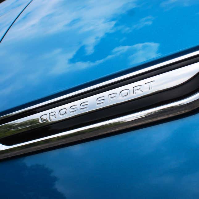 A photo of the Cross Sport badge on a VW SUV. 