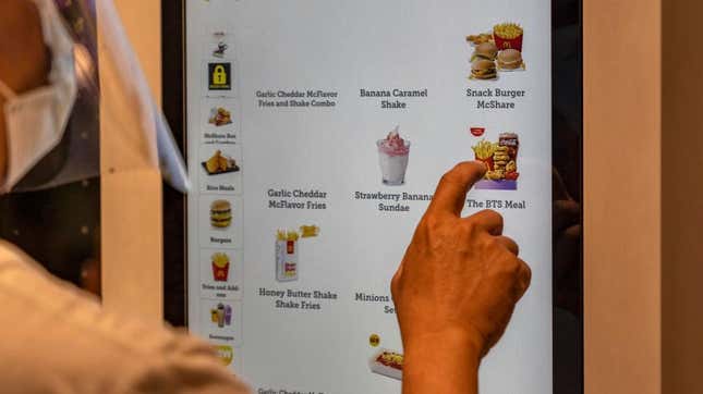 Person selecting the BTS Meal on the screen of a McDonald's digital ordering kiosk