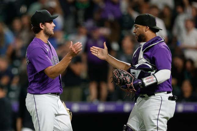 Aug 18, 2023; Denver, Colorado, USA; Colorado Rockies relief pitcher Karl Kauffmann (51) celebrates with catcher Elias Diaz (35) after the game against the Chicago White Sox at Coors Field.