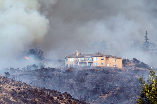 A home survives after the San Marcos wildfire in California.