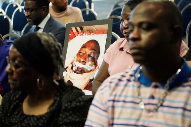 The families of Michael Corey Jenkins and Damien Cameron sit together prior to interacting with U.S. Assistant Attorney General Kristen Clarke of the Justice Department’s Civil Rights Division, unseen, during the Jackson, Miss., stop on the division’s civil rights tour, June 1, 2023. 
