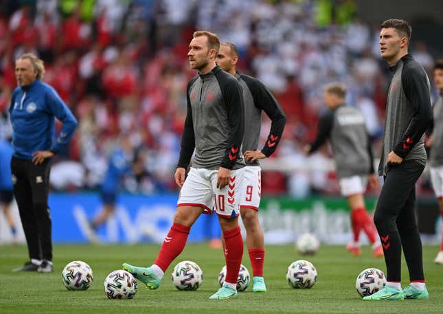 Denmark’s Christian Eriksen warms up with his team ahead of Saturday’s match against Finland.