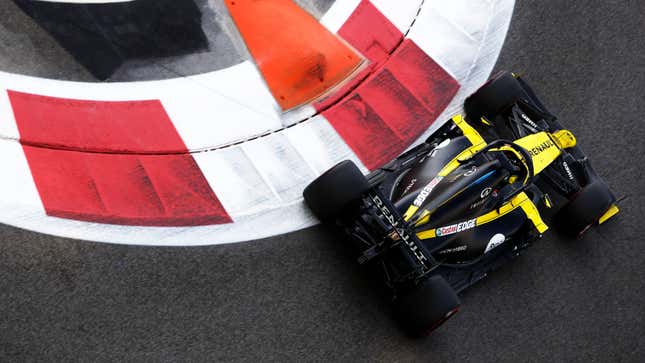 Daniel Ricciardo drives he black and yellow Renault F1 car at a race in 2020. 