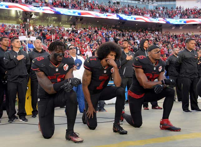 FILE PHOTO: San Francisco 49ers outside linebacker Eli Harold (58), quarterback Colin Kaepernick (7) and free safety Eric Reid (35) kneel in protest during the playing of the national anthem before a NFL game against the Arizona Cardinals in Santa Clara, California, Oct 6, 2016. Mandatory Credit: Kirby Lee-USA TODAY Sports/File Photo - RC15D997F5B0