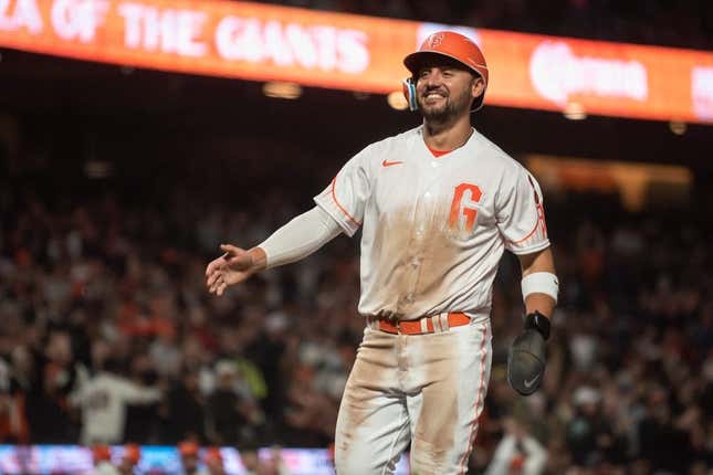 Aug 15, 2023; San Francisco, California, USA;  San Francisco Giants right fielder Michael Conforto (8) smiles after scoring during the eighth inning against the Tampa Bay Rays at Oracle Park.