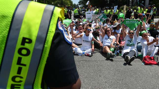 Abortion rights activists sit down in a mass civil disobedience action near the US Capitol to protest the US Supreme Court decision to overturn Roe Vs. Wade in Washington, DC, on June 30, 2022.