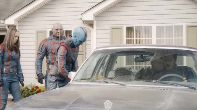 Nebula tries and fails to open the door of a '70s sedan.