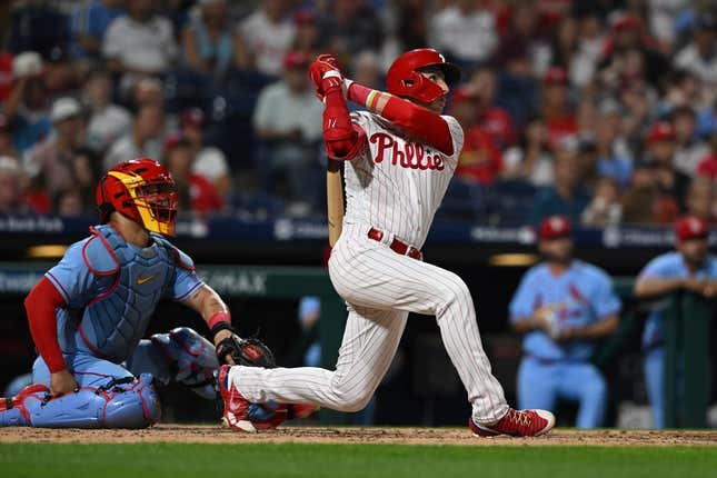 Aug 26, 2023; Philadelphia, Pennsylvania, USA;  Philadelphia Phillies second baseman Bryson Stott (5) hits a solo home run to center field during the fourth inning against the St. Louis Cardinals at Citizens Bank Park.