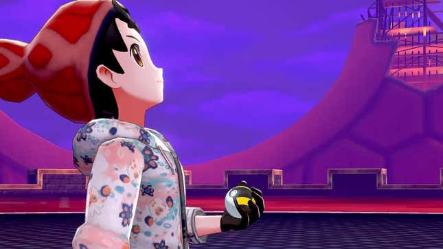 A trainer is seen holding an ultra ball and looking toward a purple sky on a rooftop.