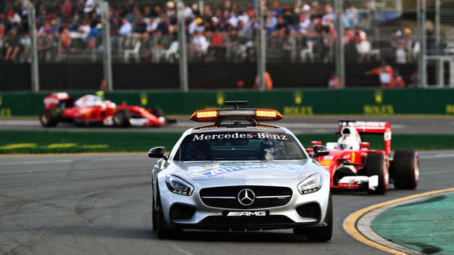A Mercedes-Benz AMG GT safety car leads a Ferrari F1 car. 