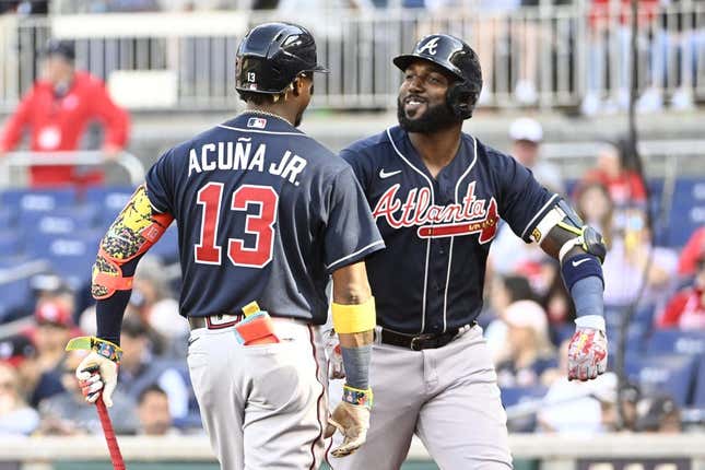 Apr 1, 2023; Washington, District of Columbia, USA; Atlanta Braves designated hitter Marcell Ozuna (20) reacts with right fielder Ronald Acuna Jr. (13) after hitting a solo home run against the Washington Nationals during the fourth inning at Nationals Park.