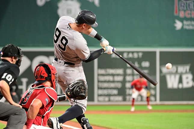 Sep 14, 2023; Boston, Massachusetts, USA; New York Yankees designated hitter Aaron Judge (99) hits a three run home run during the second inning against the Boston Red Sox at Fenway Park.
