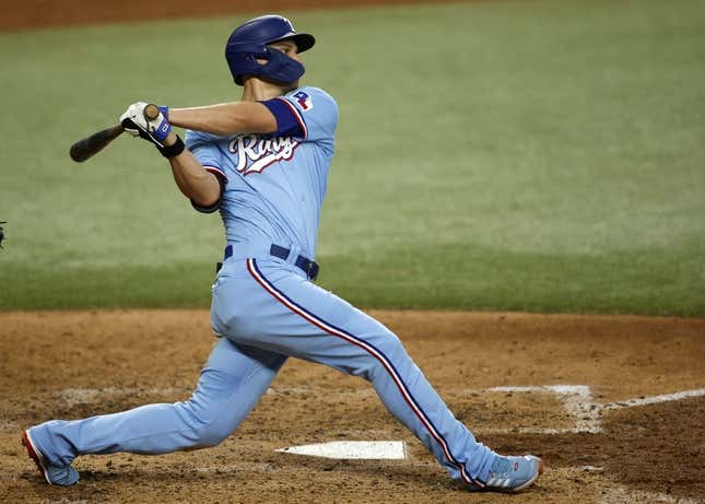 Jun 18, 2023; Arlington, TX, USA; Texas Rangers shortstop Corey Seager (5) hits a two-run RBI double in the fourth inning against the Toronto Blue Jays.