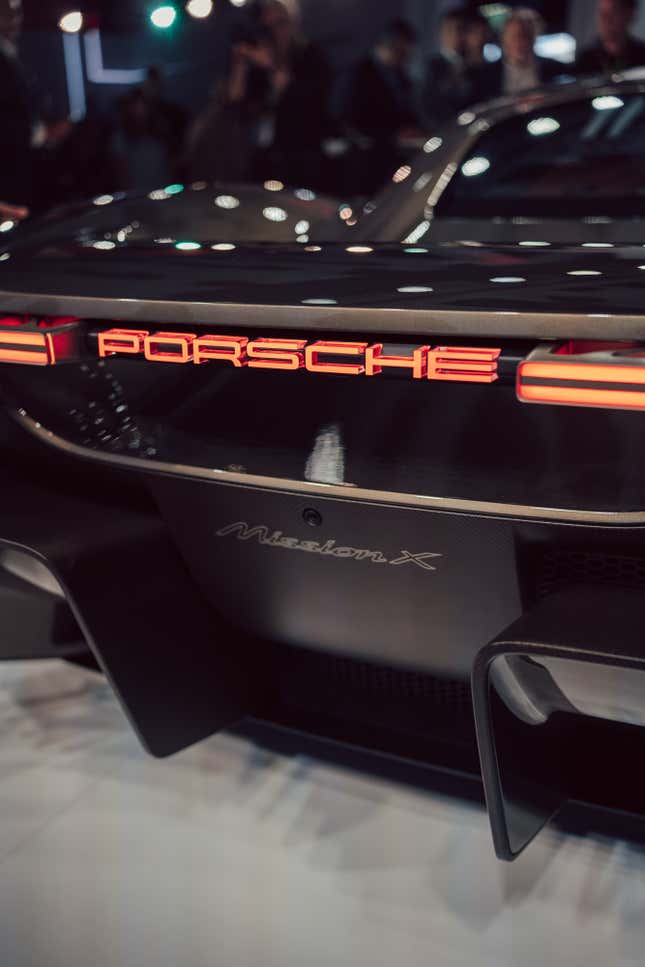 Close up shot of the rear illuminate Porsche badge.