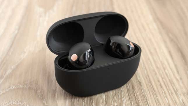 The Sony WF-1000XM5 wireless earbuds inside their charging case with the lid open.