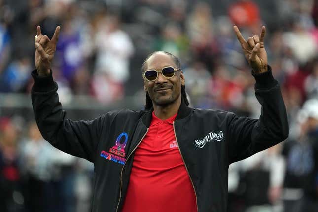 Feb 5, 2023; Paradise, Nevada, USA; AFC captain and recording artist Snoop Dogg watches from the sidelines against the NFC during the Pro Bowl Games at Allegiant Stadium.