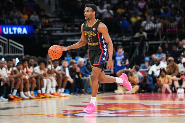 HOUSTON, TEXAS - MARCH 28: Bronny James #6 of the West team dribbles the ball during the 2023 McDonald’s High School Boys All-American Game at Toyota Center on March 28, 2023 in Houston, Texas.