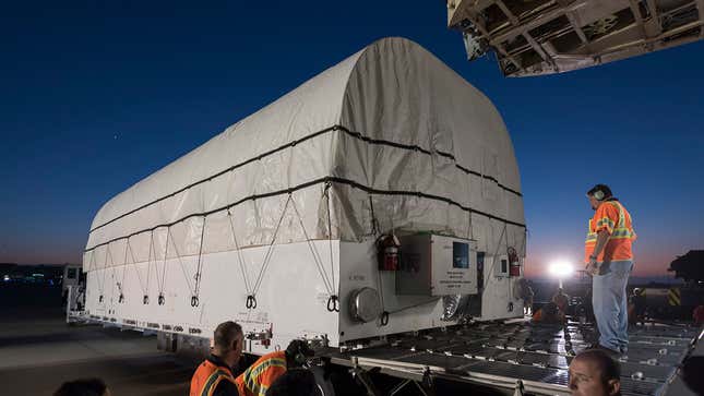Loading the satellite container onto the C-5 Galaxy.