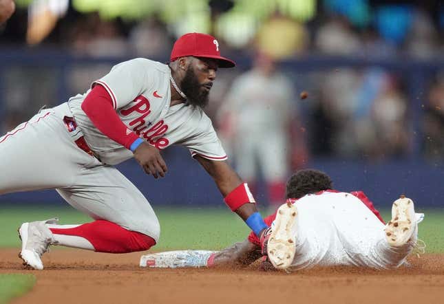 Jul 8, 2023; Miami, Florida, USA; Philadelphia Phillies second baseman Josh Harrison (2) tags out Miami Marlins center fielder Dane Myers (54) at second base in the first inning at loanDepot Park.