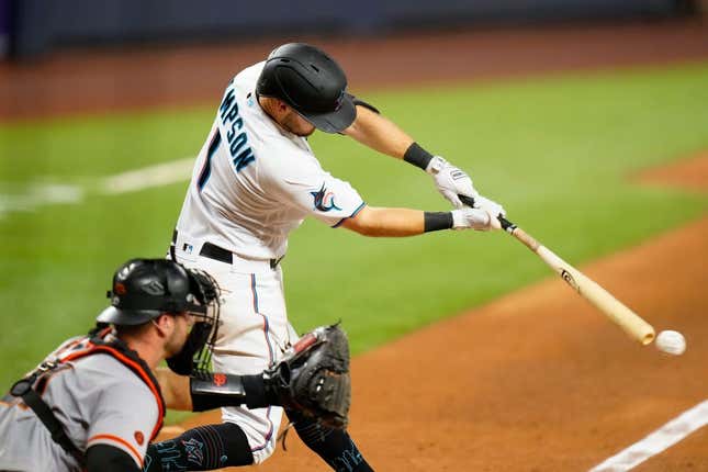 Apr 17, 2023; Miami, Florida, USA; Miami Marlins shortstop Garrett Hampson (1) hits a single against the San Francisco Giants during the sixth inning at loanDepot Park.