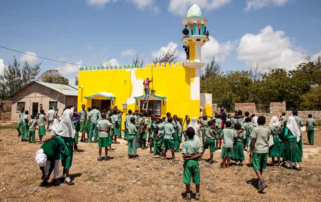 Image for article titled An artist has painted mosques and churches across Kenya yellow to promote peace