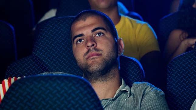 Image for article titled Moviegoer Frustrated By Loud Guy In Next Row Who Won’t Stop Shooting