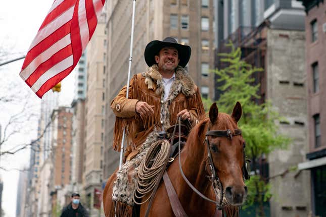 Otero County Commission Chairman and Cowboys for Trump co-founder Couy Griffin rides his horse on 5th avenue on May 1, 2020, in New York City. Mayor Bill De Blasio said New York City had seen a decline in coronavirus hospitalizations and the rate of people testing positive for the disease. However, that reopening is still a few months away. (