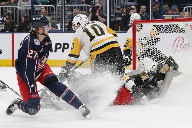 Apr 13, 2023; Columbus, Ohio, USA; Columbus Blue Jackets goalie Michael Hutchinson (31) makes a save as Pittsburgh Penguins left wing Drew O&#39;Connor (10) looks for a rebound during the first period at Nationwide Arena.