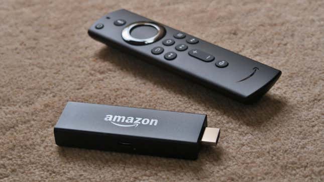 An Amazon Fire TV Stick and remote on a table