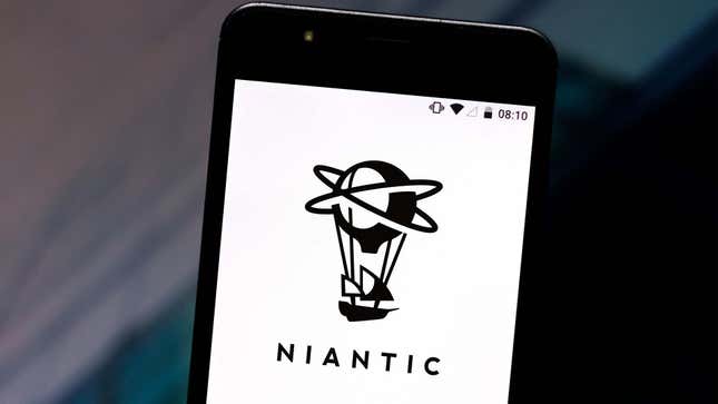 A close up photo of a phone screen shows the Niantic logo.