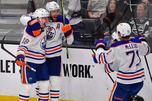 Apr 23, 2023; Los Angeles, California, USA; Edmonton Oilers left wing Zach Hyman (18) celebrates his goal scored against the Los Angeles Kings with center Leon Draisaitl (29) and center Ryan McLeod (71) during overtime in game four of the first round of the 2023 Stanley Cup Playoffs at Crypto.com Arena.