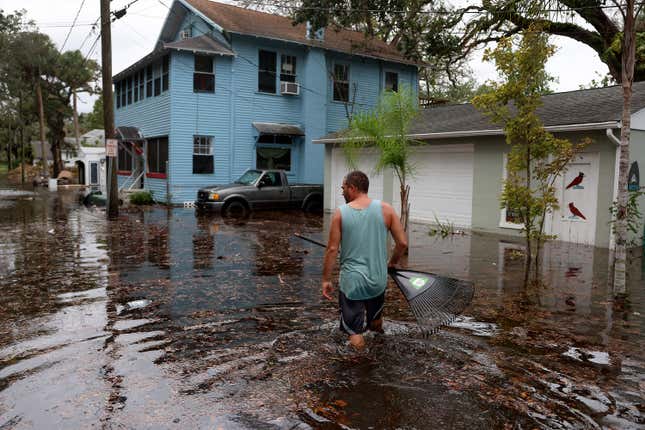 Man wading in floodwaters