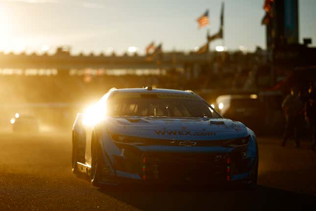 Ross Chastain, driver of the No. 1 Worldwide Express/Advent Health Chevrolet, drives drives through the garage area as the sun sets during practice for the NASCAR Cup Series Championship at Phoenix Raceway on November 04, 2022 in Avondale, Arizona.
