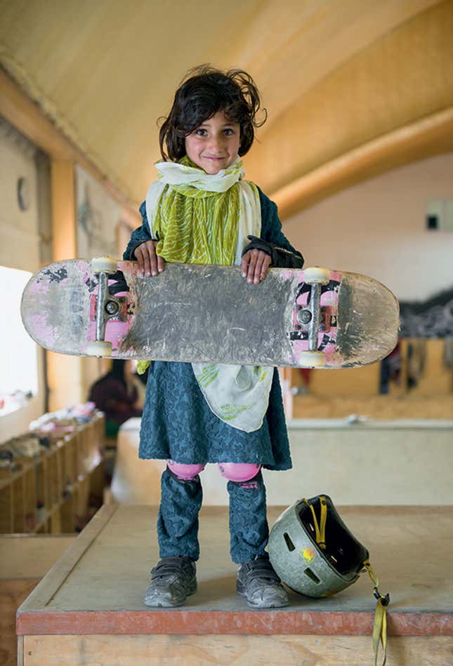Image for article titled Photos: Forbidden from riding bikes, fearless Afghan girls are skateboarding around Kabul