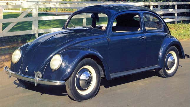 A photo of a dark blue Volkswagen Beetle. 
