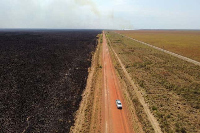 Aerial view of the Route number 40 showing a field burnt by firefighters to fight wildfires at the Ibera National Park.