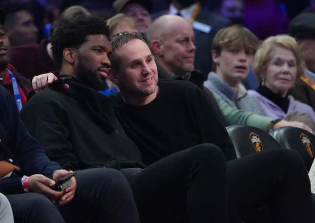 Fanatics CEO Michael Rubin poses with NBA star Joel Embiid