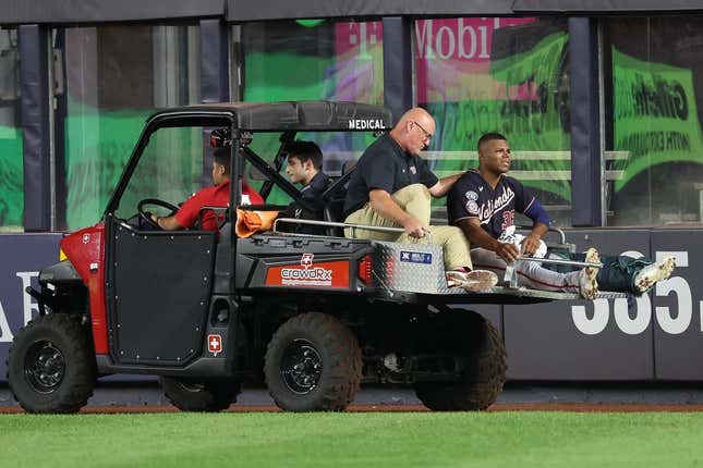 Aug 23, 2023; Bronx, New York, USA; Washington Nationals left fielder Stone Garrett (36) is driven off  the field after an injury during the seventh inning against the New York Yankees at Yankee Stadium.