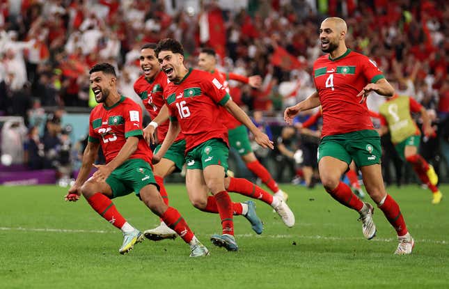 Morocco celebrates after win over Spain.