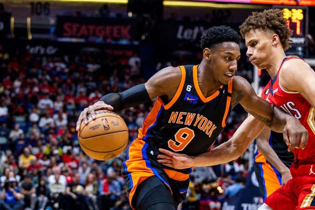 Apr 7, 2023; New Orleans, Louisiana, USA;  New York Knicks guard RJ Barrett (9) dribbles against New Orleans Pelicans guard Dyson Daniels (11) during the first half at Smoothie King Center.